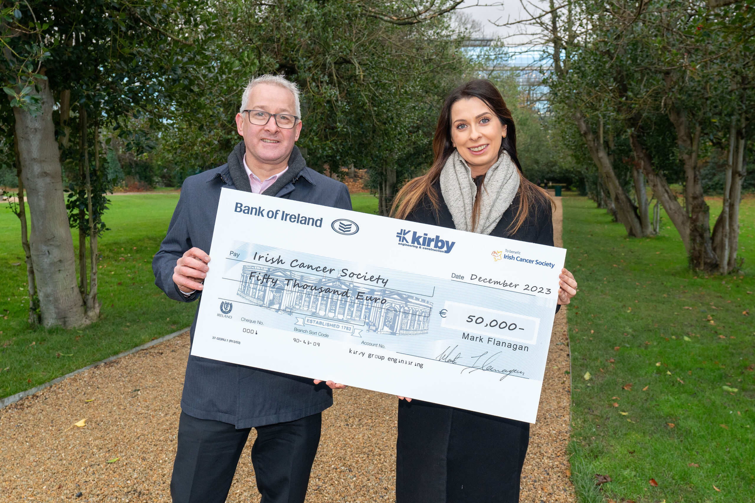 Kirby Group Managing Director, Mark Flanagan, presents Alison Reynolds, Corporate Partnerships Officer, from the Irish Cancer Society, with a Christmas donation cheque for €50,000.