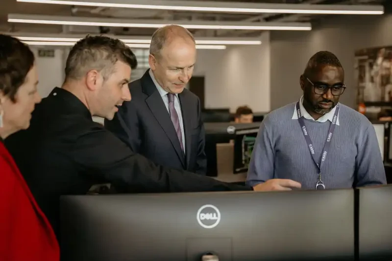 Associate Director - BIM/Technical Services at Kirby Mark Danaher (left) and BIM Engineer Simon Mugwanyo (right) discussing the company’s leading edge projects with Tánaiste and Minister for Foreign Affairs Micheál Martin TD.
