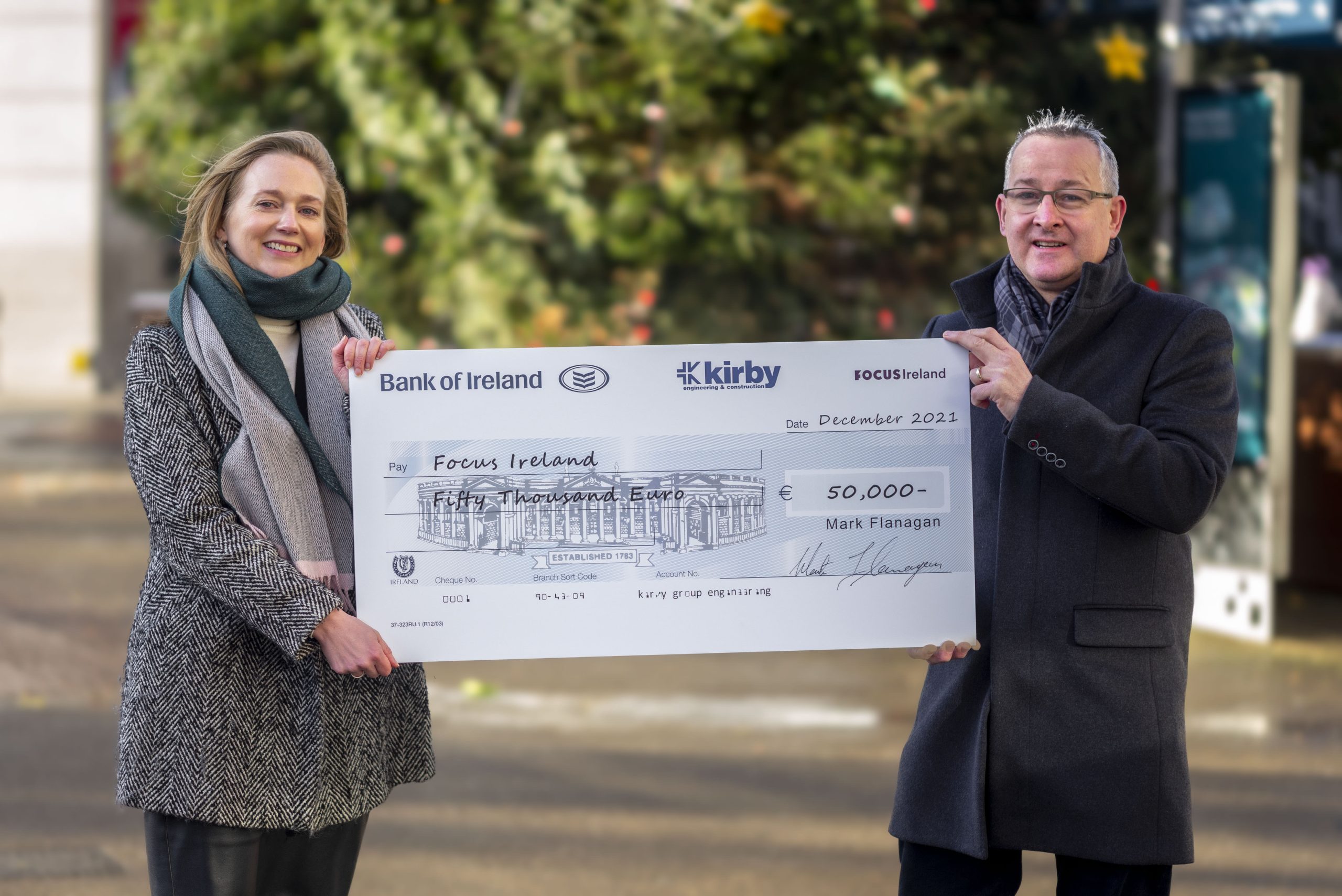 Kirby Group Managing Director, Mark Flanagan, presents Amy Carr, Director of Fundraising and Marketing of Focus Ireland, with a Christmas donation cheque for €50,000