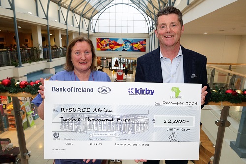 Jimmy Kirby, Group Managing Director, presenting donation to ReSurge Africa