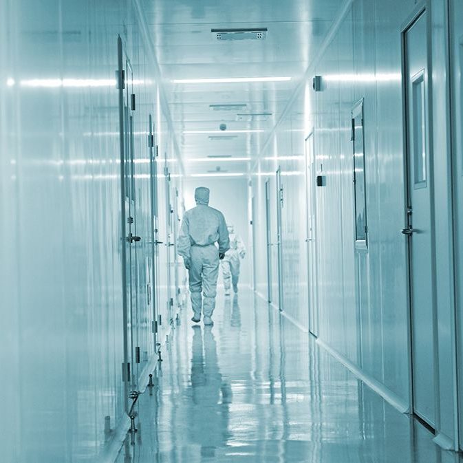 Technicians working in the pharmaceutical production line